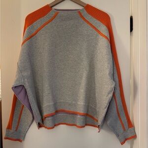 Cute, comforting able multicolored sweater frok Anthropologie.